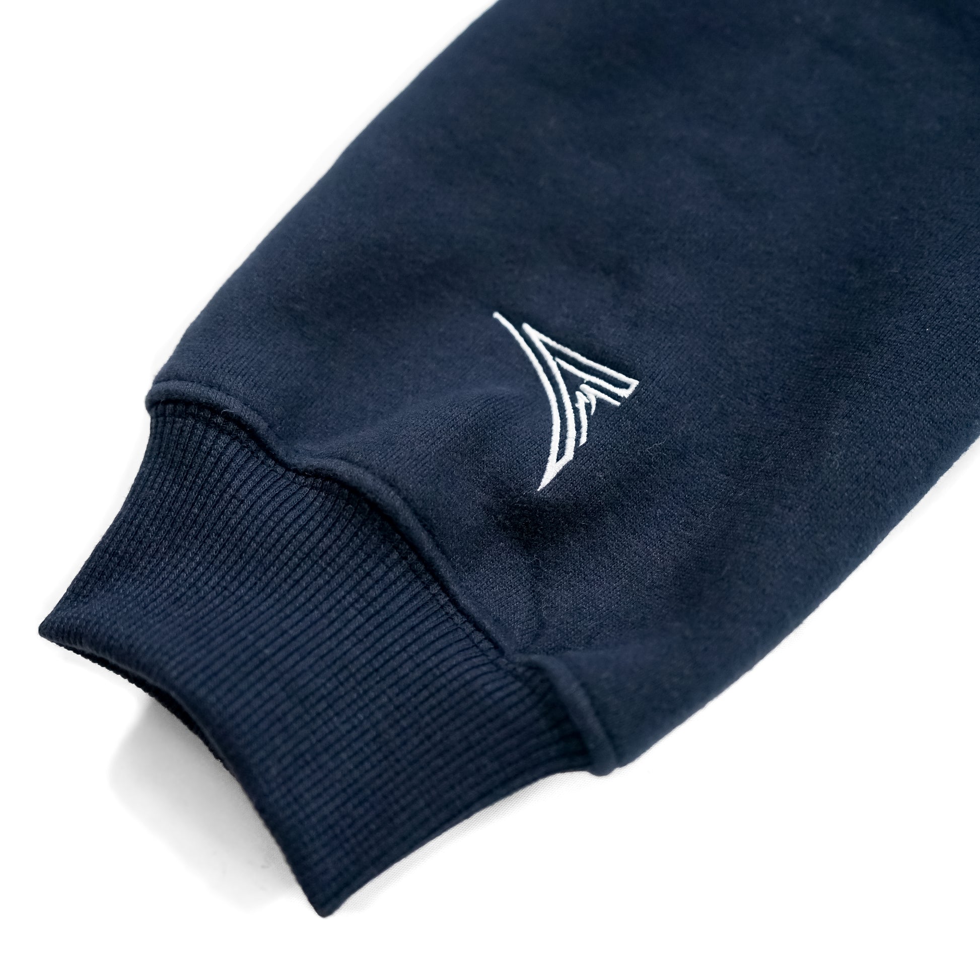 navy blue sleeve with a AmSTRONG embroidered logo