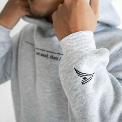 grey hoodie with a black embroidered logo