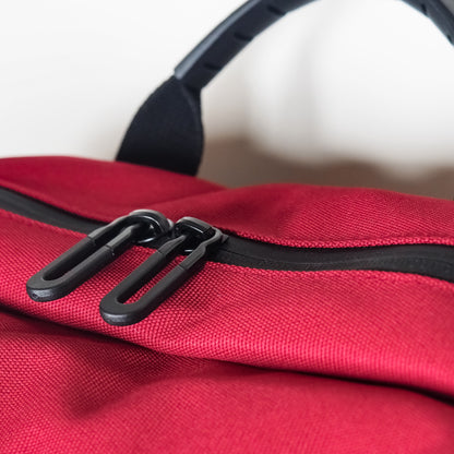 black waterproof zip on red fabric