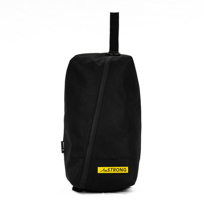 AmSTRONG black shoes bag with a diagonal zip and yellow metallic label