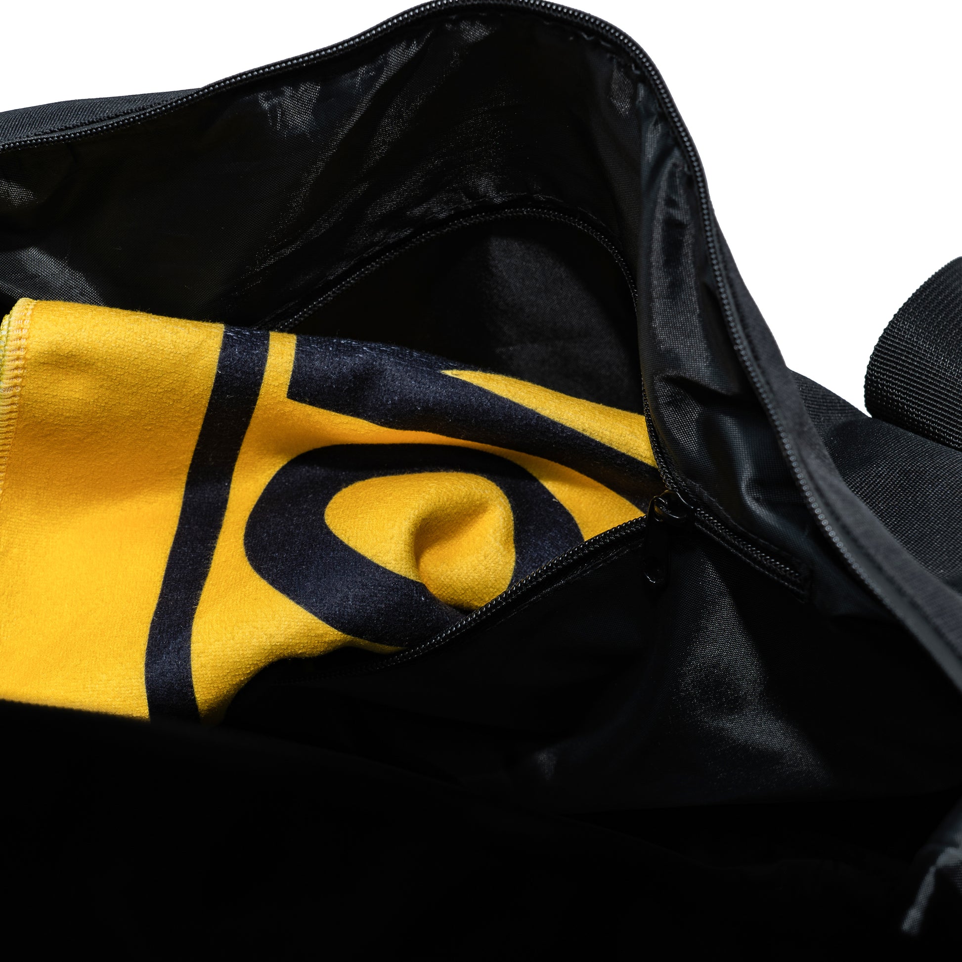 a yellow sport towel stashed in a zip pocket