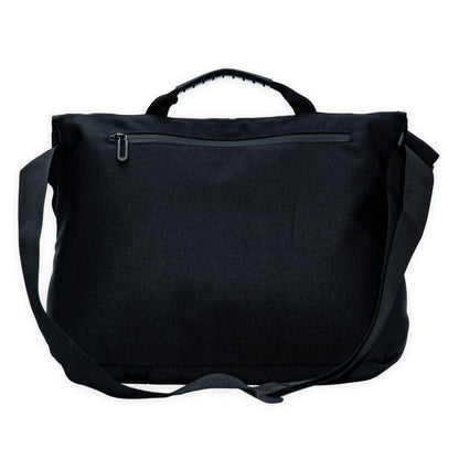 zipped pocket at the back of a black crossbody bag